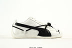 PUMA White & Black Low-Top Sneakers with Cross-Detail Accents