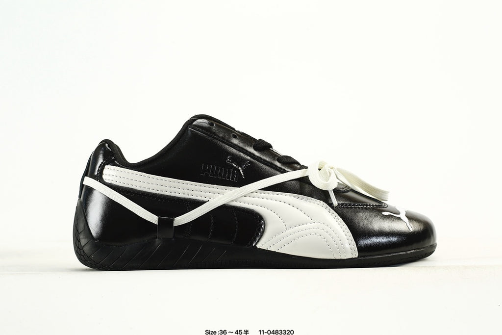 PUMA Black & White Low-Top Sneakers with Cross-Detail Accents