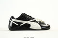 PUMA Black & White Low-Top Sneakers with Cross-Detail Accents