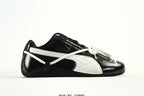 PUMA Black & White Low-Top Sneakers with Cross-Detail Accents