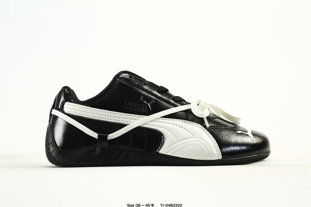 PUMA Black & White Low-Top Sneakers with Cross-Detail Accents