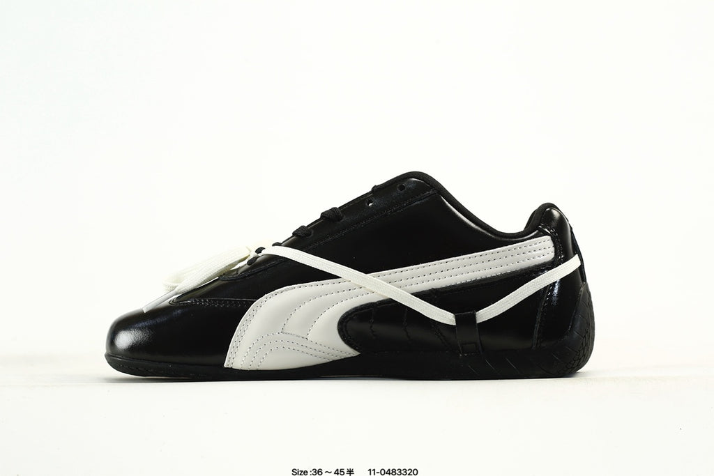 PUMA Black & White Low-Top Sneakers with Cross-Detail Accents