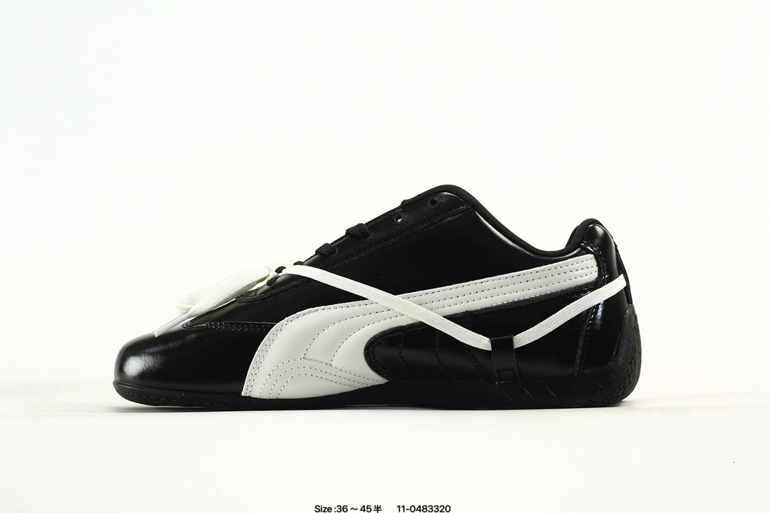 PUMA Black & White Low-Top Sneakers with Cross-Detail Accents
