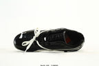 PUMA Black & White Low-Top Sneakers with Cross-Detail Accents