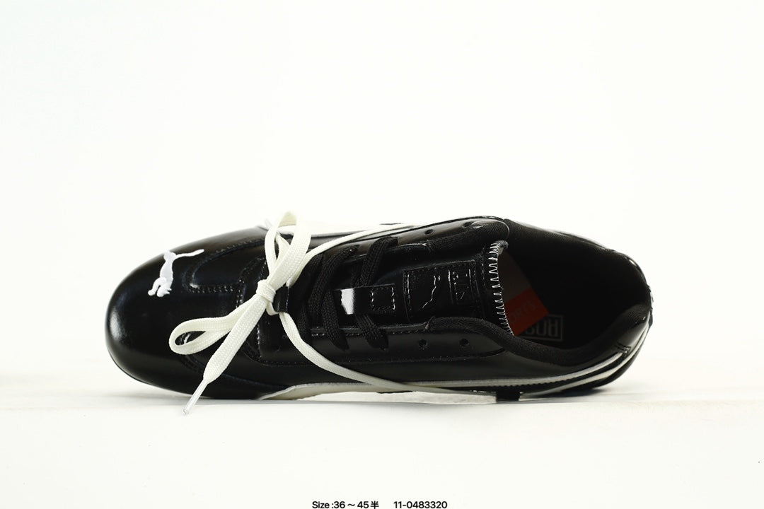 PUMA Black & White Low-Top Sneakers with Cross-Detail Accents
