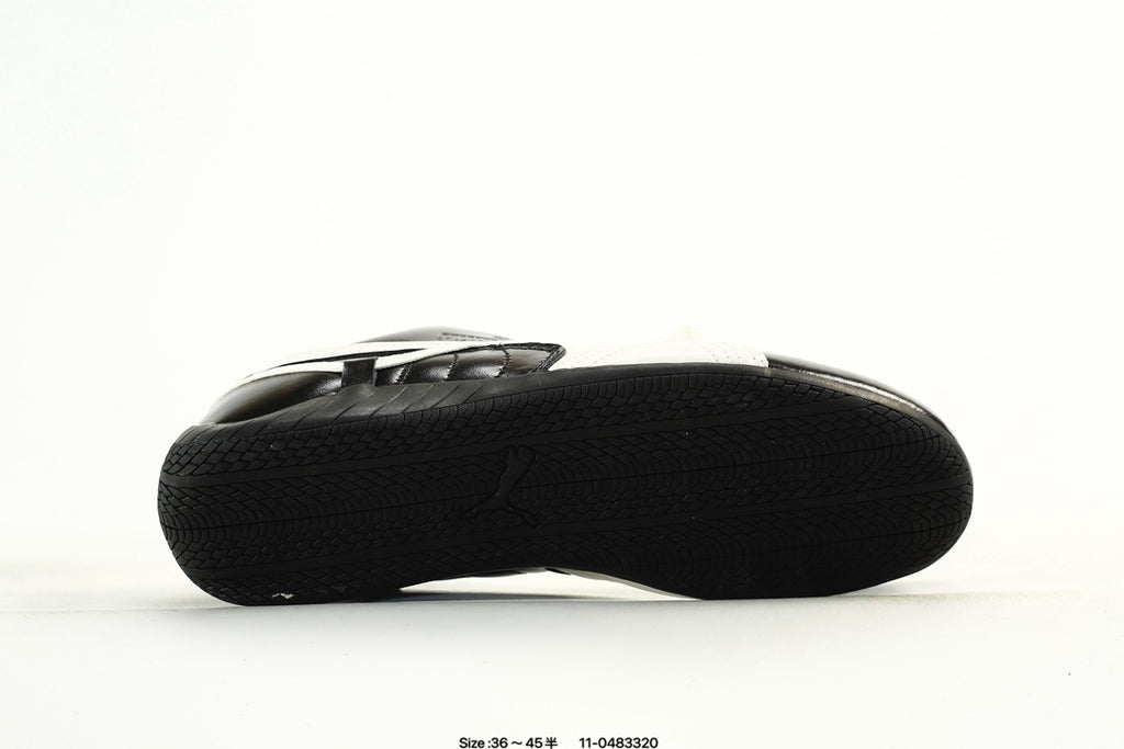 PUMA Black & White Low-Top Sneakers with Cross-Detail Accents