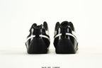 PUMA Black & White Low-Top Sneakers with Cross-Detail Accents