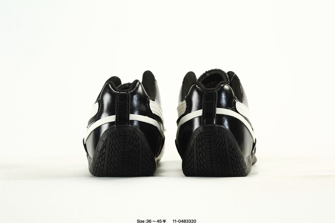 PUMA Black & White Low-Top Sneakers with Cross-Detail Accents
