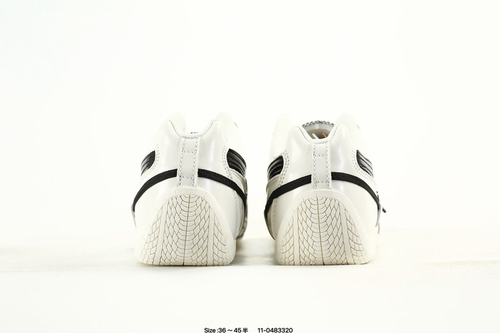 PUMA White & Black Low-Top Sneakers with Cross-Detail Accents