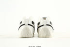PUMA White & Black Low-Top Sneakers with Cross-Detail Accents
