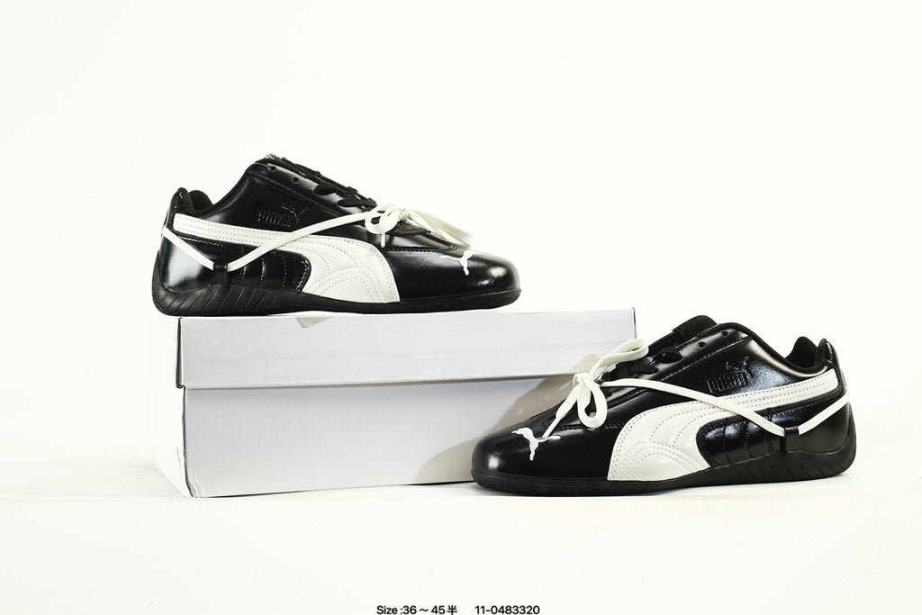 PUMA Black & White Low-Top Sneakers with Cross-Detail Accents