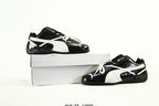 PUMA Black & White Low-Top Sneakers with Cross-Detail Accents