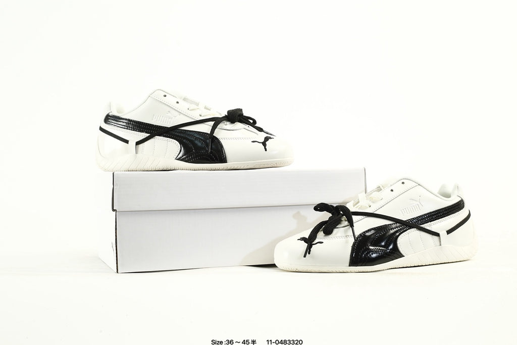 PUMA White & Black Low-Top Sneakers with Cross-Detail Accents