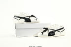PUMA White & Black Low-Top Sneakers with Cross-Detail Accents
